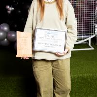 Woman poses with certificate and award. Stephanie McGeoch, Young Person Achievement Award