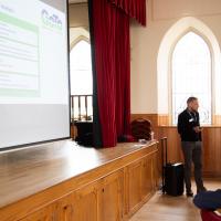 Presentation shown on a large projector screen 