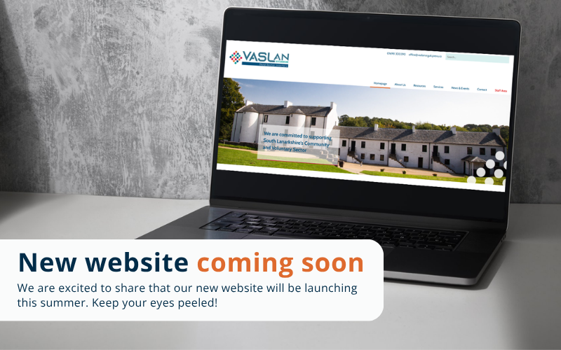 Laptop sits on desk with text reading: New website coming soon. Launching in summer. 